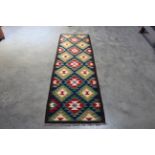 An approx. 6'5" x 2' Maimana Kilim rug