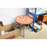 A gipsy type table raised on spiral twist supports