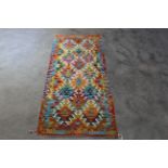 An approx. 4'9" x 2'1" Chobi Kilim rug