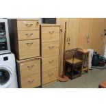 A wood effect four drawer filing cabinet with key