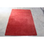 An approx. 5'8" x 4' modern rug