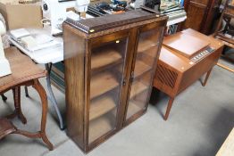 An oak and glazed upper section of a bookcase