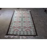 An approx 7'2" x 3'10" Kilim type rug
