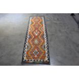 An approx. 6'5" x 2' Chobi Kilim rug