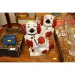 A pair of Staffordshire spaniel ornaments