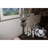 A brass Corinthian column table oil lamp with clea
