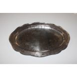 A white metal serving dish