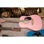 A Swift pink acoustic guitar