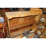 An antique stripped pine plate rack