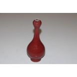 A Chinese style red glazed vase