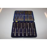 A cased set of silver handled fruit knives and forks, silver plated fish knives and forks