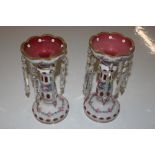 A pair of floral decorated lustres with prism drop