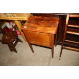 A mahogany bedside cabinet with drop front