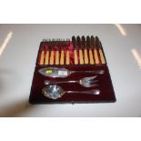 A cased Walker & Hall serving set; and a set of bone handled silver collared fish knives and forks