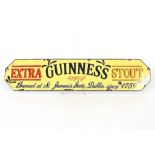 A Guinness Stout style enamel advertising sign