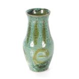 A blue glazed baluster Studio pottery vase with mo