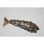 An articulated fish decorated with abalone shell