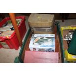 A box containing various games, a vintage reel-to-