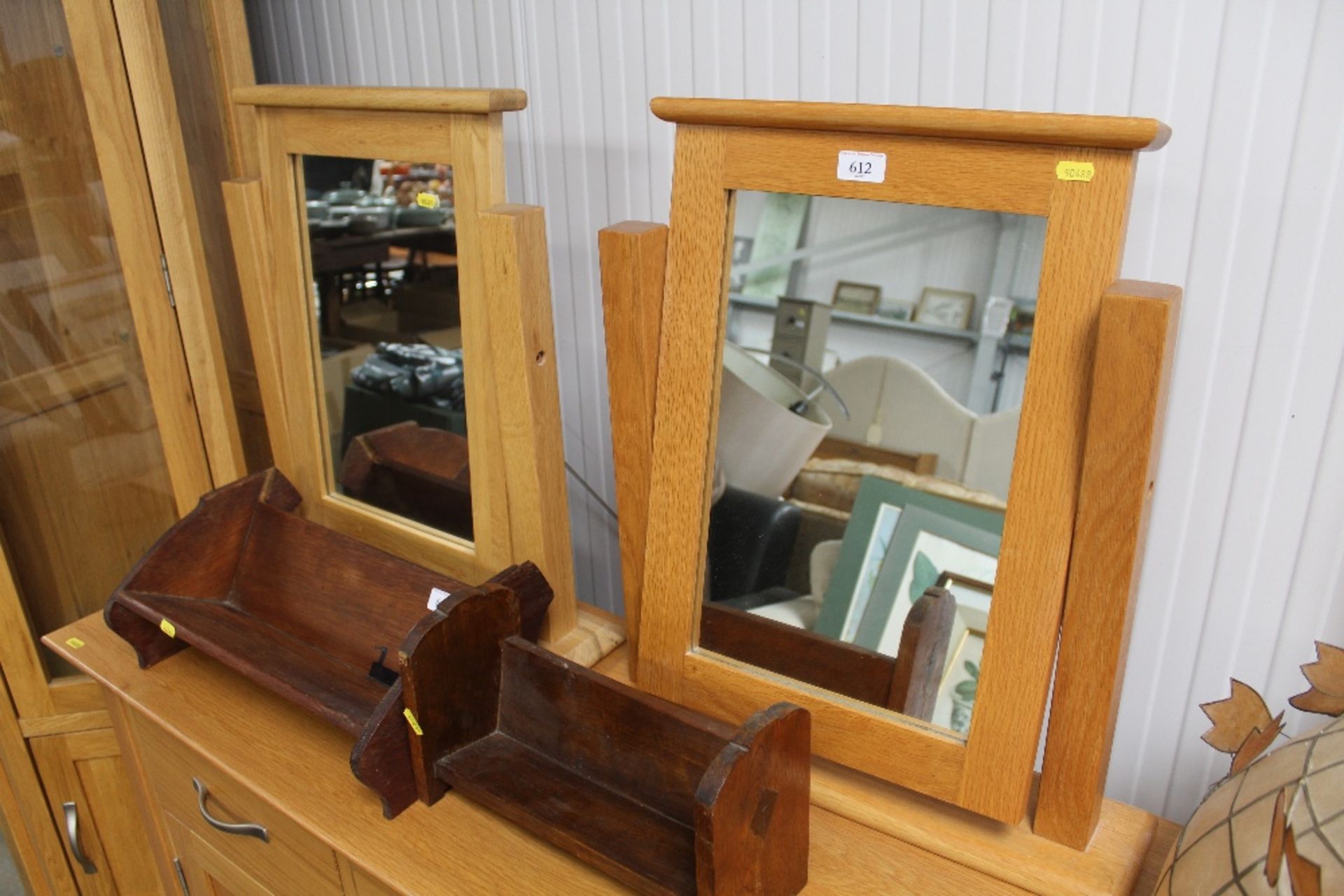 Two oak swing framed mirrors