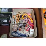 A box of various costume jewellery