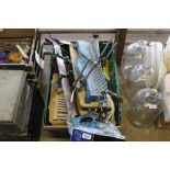 A plastic crate containing mitre saw jig, various spare brush heads, hand sprayers etc