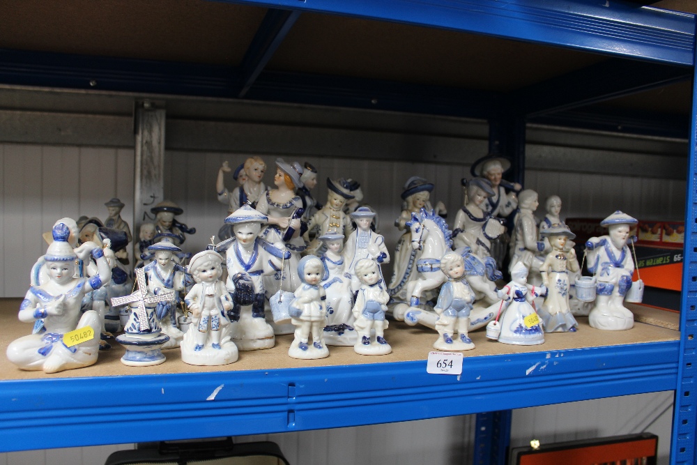 A quantity of blue and white figures and figure gr