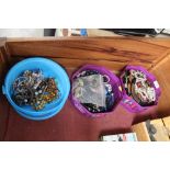 Three tubs of various costume jewellery