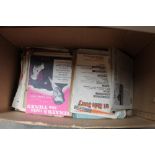 A box of various sheet music