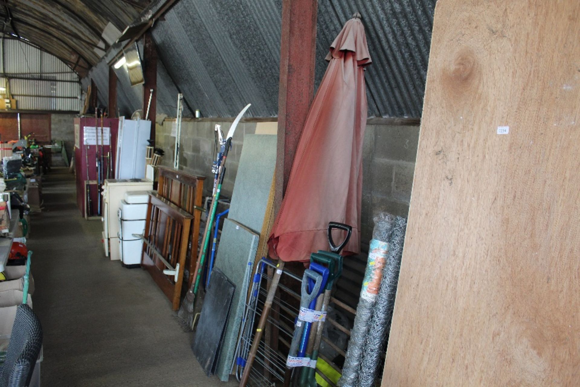 A garden parasol and a folding clothes airier