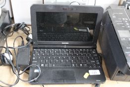 A Toshiba Notebook and charger, sold as seen