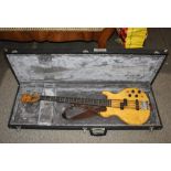 A Pine bass guitar in hard case