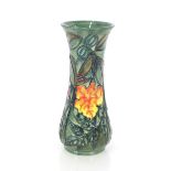 A Moorcroft baluster vase with flower head and le