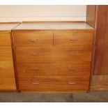 A teak and laminate chest of two short and three l