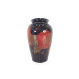 A Moorcroft "Pomegranate" baluster vase, 14cm hig