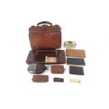 A leather doctor's bag; various other leather case