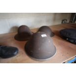 Three WWI helmets