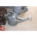 A Batt galvanised watering can with rose