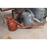 A Haws long spout watering can