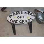 A cast iron "Please Keep Off The Grass" sign