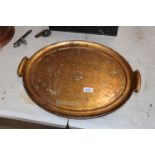 An oval gilt twin handled tea tray