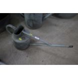 A Haws long spout galvanised watering can