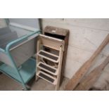 A set of wooden small platform steps and a metal s