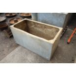 A galvanised riveted water tank, approx. 4' x 2' x 2'