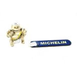 A cast iron Michelin Man Registration 67548 and a