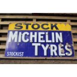 A vintage enamel advertising sign for "Stock Miche