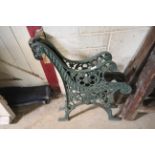 A pair of heavy cast iron bench ends