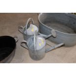 A vintage galvanised 2 gallon watering can and ano