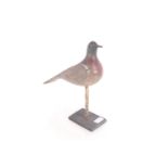 A painted wooden decoy pigeon raised on base, 12½"