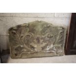 An antique carved stone decorative slab
