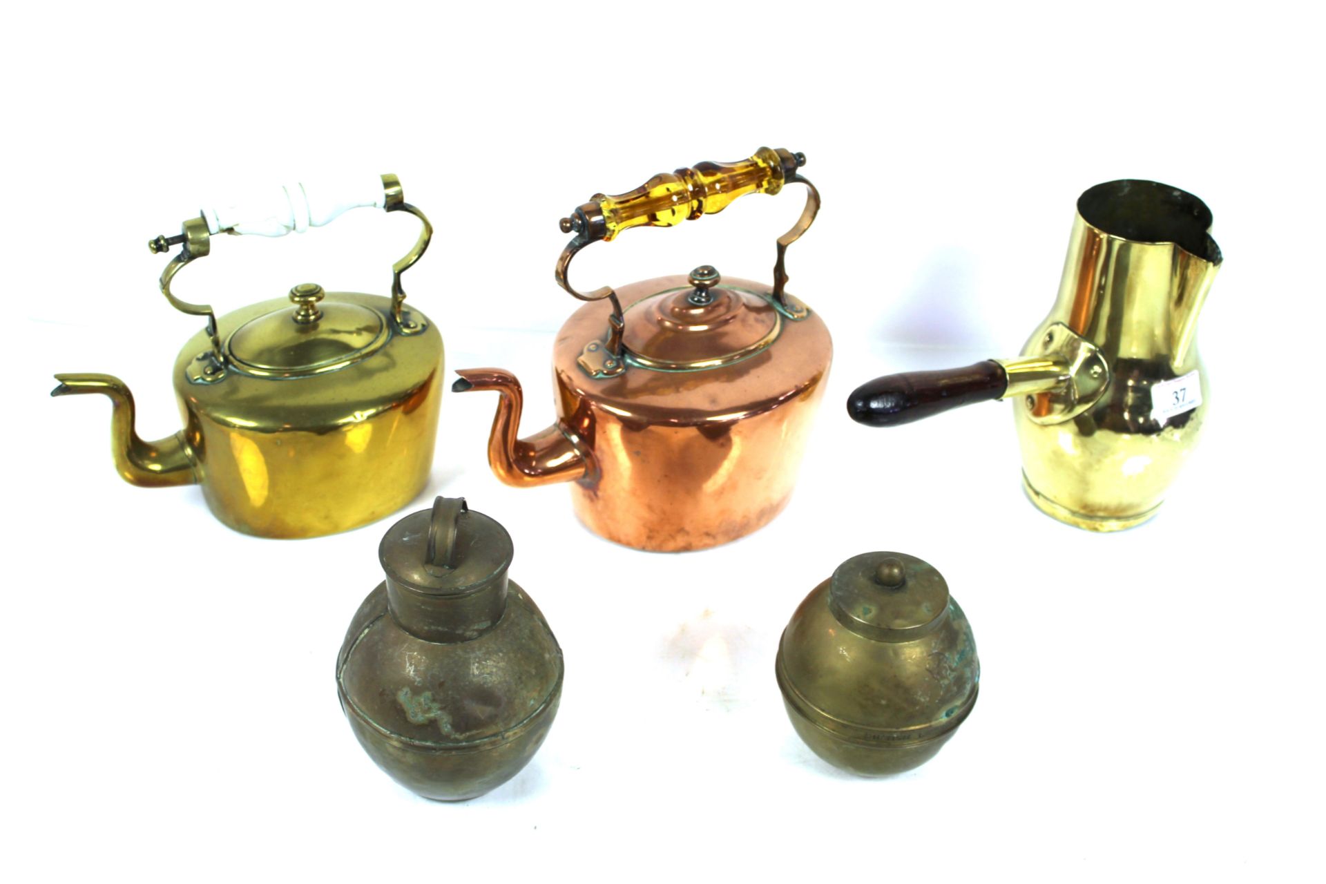 A brass chocolate pot, a brass kettle with porcela